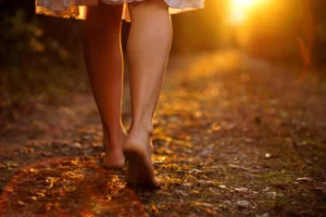 Woman walking barefoot