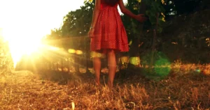Autumn treats for your feet - a woman walking in a meadow in autumn