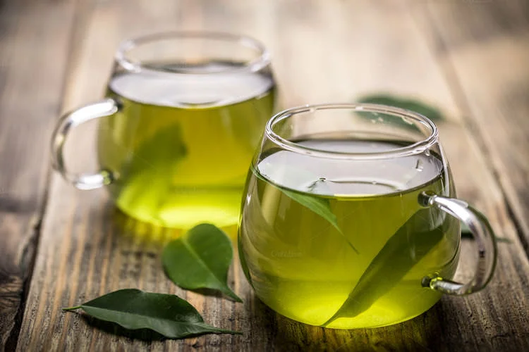 The benefits of green tea - Two cups of green tea on a table