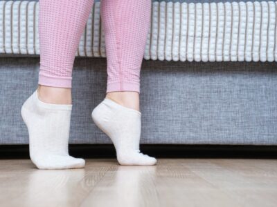 The benefits of bamboo socks - young woman walking in bamboo socks