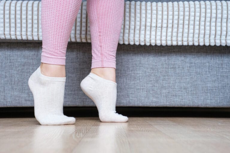 The benefits of bamboo socks - young woman walking in bamboo socks