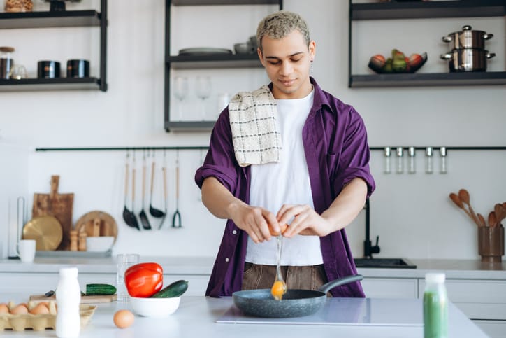 Person cooking filling foods