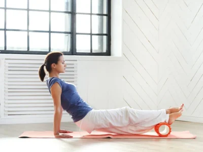 the benefits of foam rolling for your feet, demonstrated by a young woman