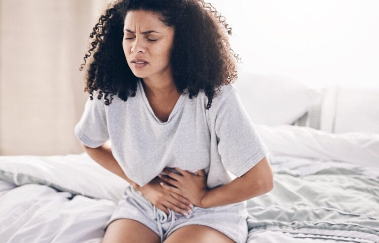 Young woman with stomach cramps