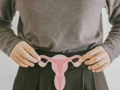 Woman holding an image referring to PCOS