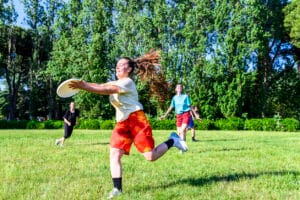 People playing a game of tag rugby in a field