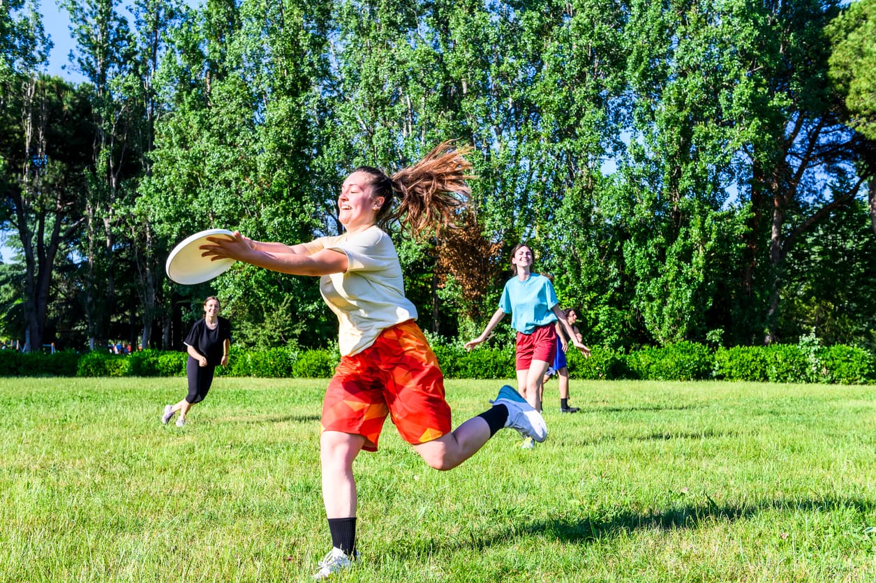 People playing a game of tag rugby in a field