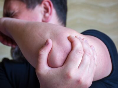 Man with pins and needles in his elbow