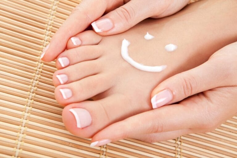 Foot with skincream in the shape of a smiley face