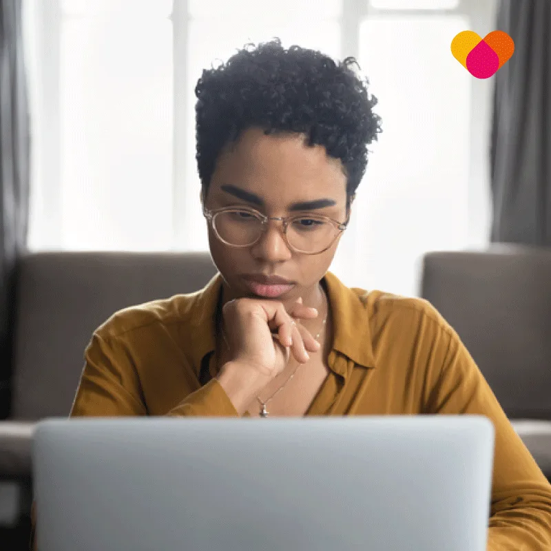 Young woman completing an ergonomic assessment on her laptop