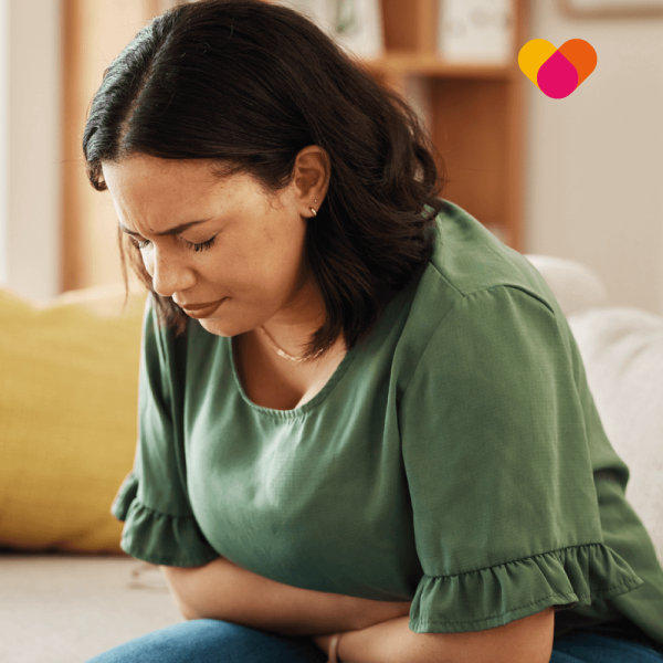 Woman with stomach pain due to bloating