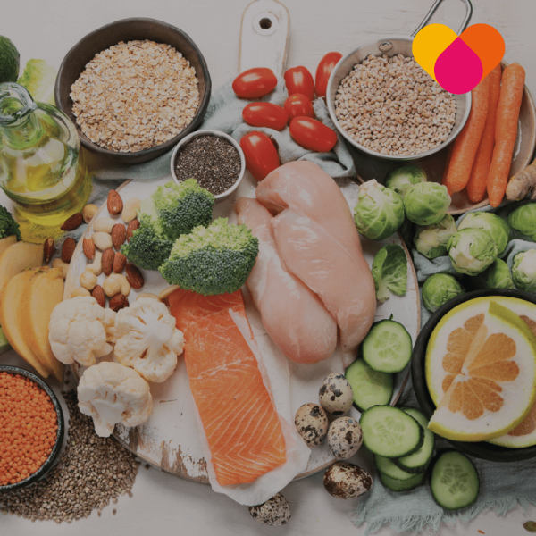 Cancer-Care—Nutrition Table filled with healthy meat fruit and vegetables