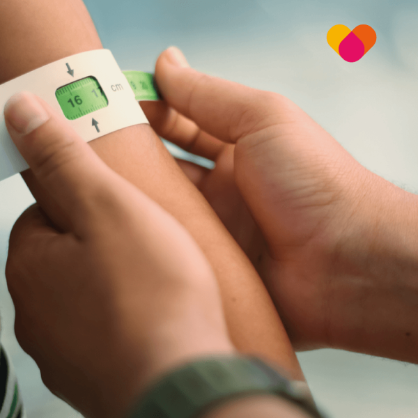 Underweight person having their body mass checked